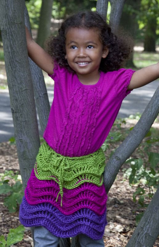 A little girl in a tree