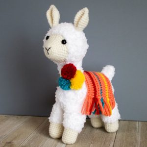 A close up of a stuffed llama 