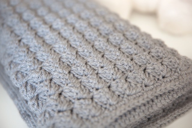A close up of a grey blanket