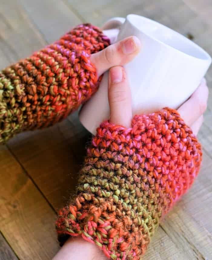 Lion Brand Unique yarn Texting Mitts Free Crochet Pattern shown with coffee cup