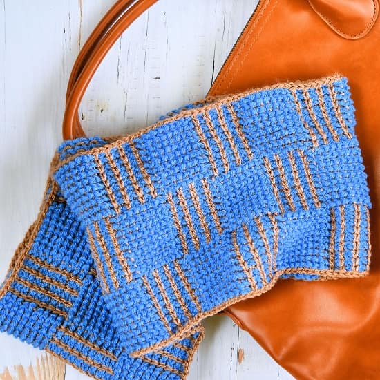 A gold and blue crochet scarf