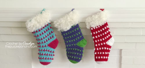 3 Crochet Christmas Stockings hanging on a fireplace